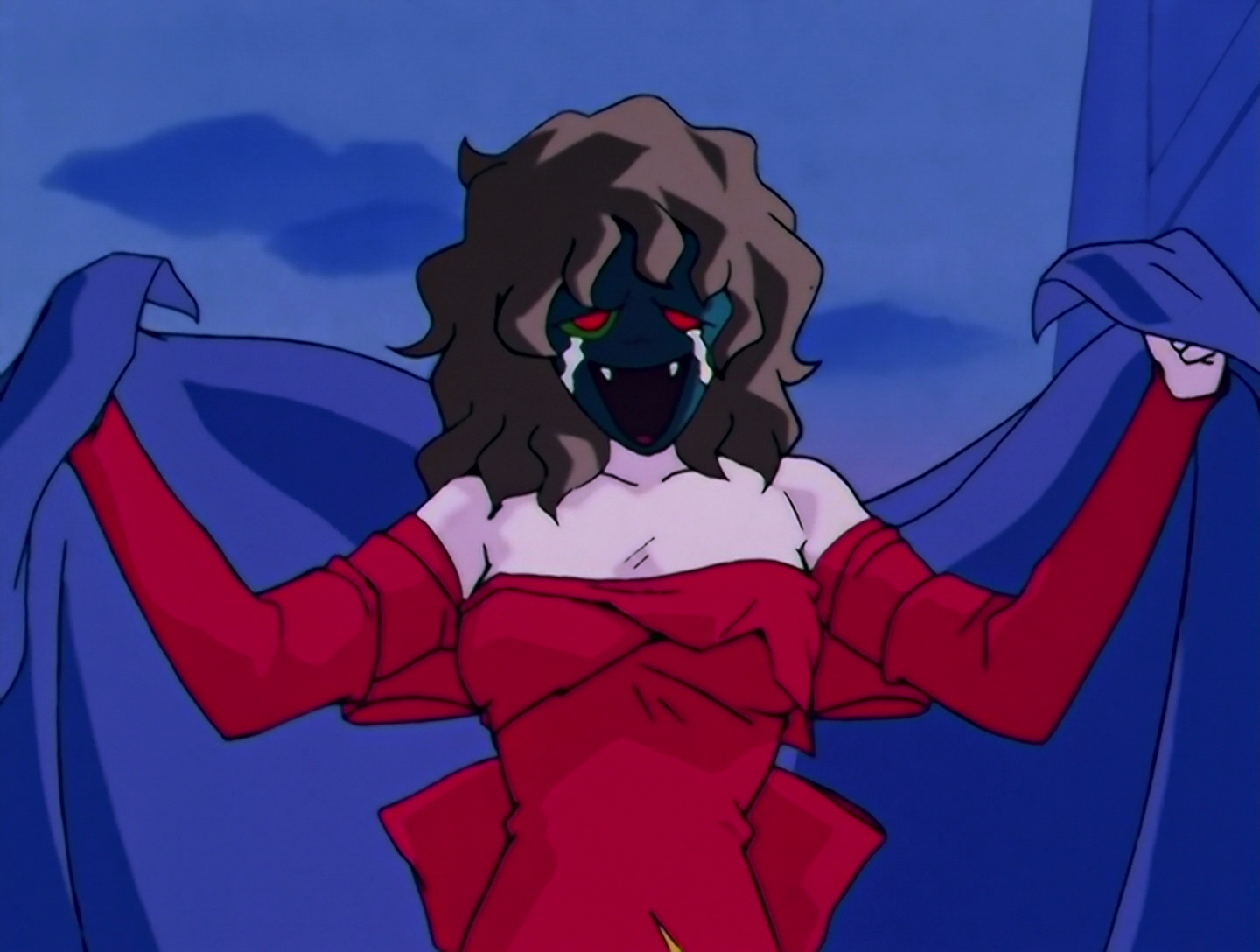 Scar, a Daimon from Sailor Moon episode 96. She has pale white skin, and wears a dark blue mask with messy brownish hair. The mask displays a strange, crying face with visible fangs. She’s wearing a red dress that seems to be wrapped around her, and she’s emerging from under a blue sheet.